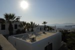 Elysium - Mykonos Hotel with a sun lounge